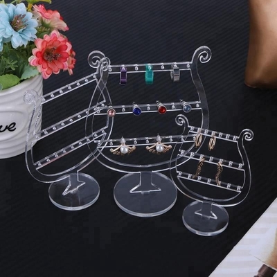 Présentoirs tournants acryliques de boucle d'oreille de maquillage de luxe clair