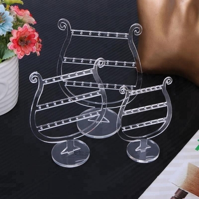 Présentoirs tournants acryliques de boucle d'oreille de maquillage de luxe clair