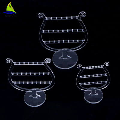 Présentoirs tournants acryliques de boucle d'oreille de maquillage de luxe clair