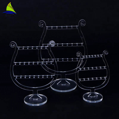 Présentoirs tournants acryliques de boucle d'oreille de maquillage de luxe clair