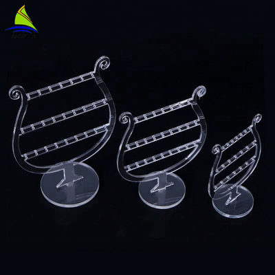 Présentoirs tournants acryliques de boucle d'oreille de maquillage de luxe clair