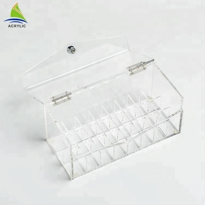 La vitrine acrylique transparente de rouge à lèvres de maquillage composent l'organisateur