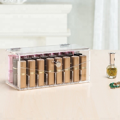La vitrine acrylique transparente de rouge à lèvres de maquillage composent l'organisateur